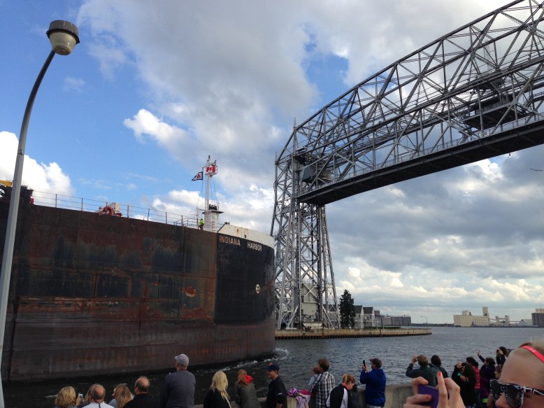 Barge going under Aerial Lift Bridge at Canal Park in Duluth, Minnesota
